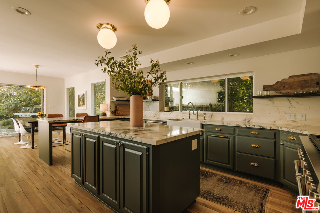 2610 Mandeville Canyon Road Los Angeles, CA 90049 - Photo 15 of 32 a kitchen with lots of counter space and sink