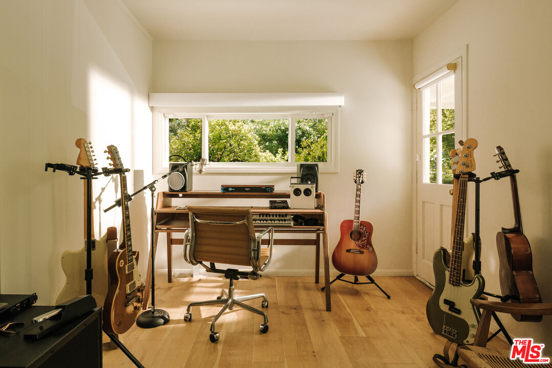 2610 Mandeville Canyon Road Los Angeles, CA 90049 - Photo 20 of 32 a view of a workspace with gym equipment