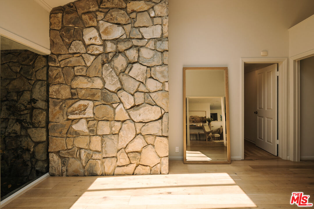 2610 Mandeville Canyon Road Los Angeles, CA 90049 - Photo 4 of 32 a view of a wooden door