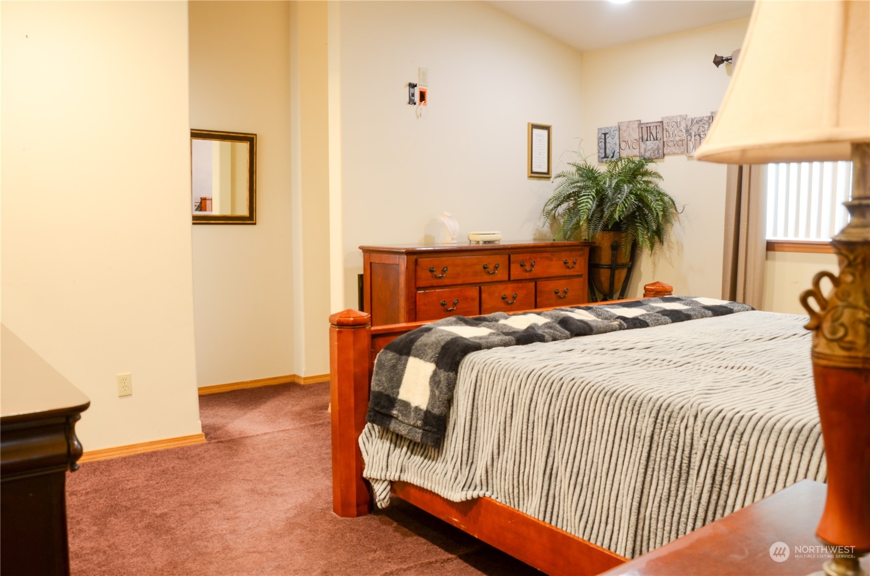 1241 North Sage Road Ritzville, WA 99169 - Photo 23 of 40 a bedroom with a bed and a lamp on table