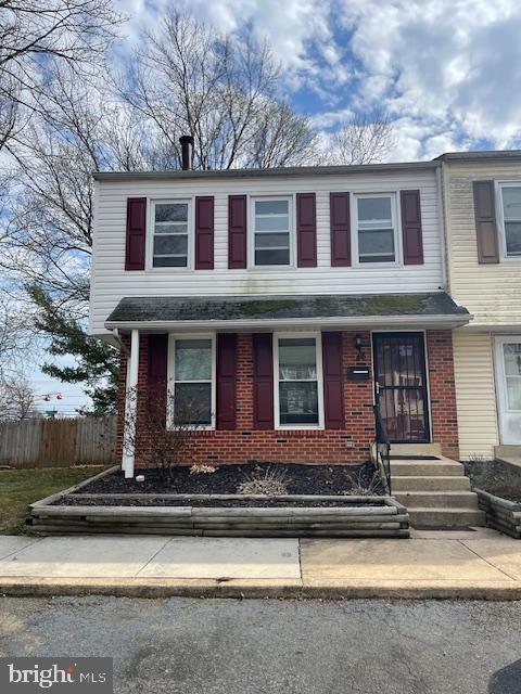 48 Fleming Street Newark, DE 19713 - Photo 1 of 16 a view of a house with small yard plants and large tree