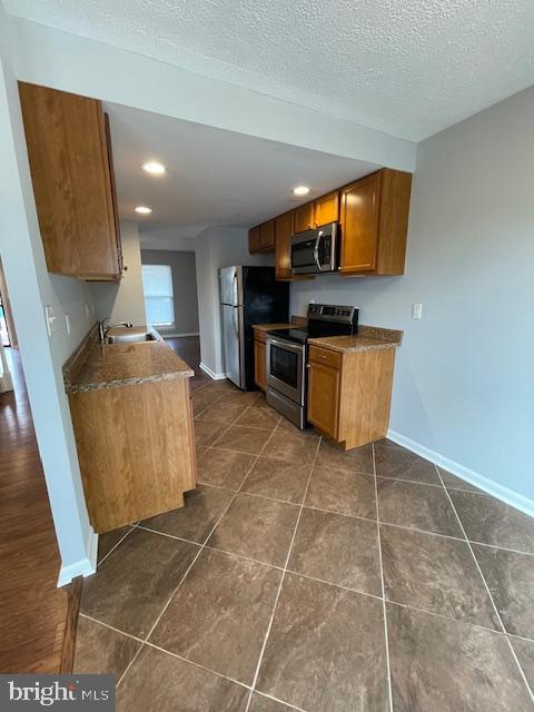 48 Fleming Street Newark, DE 19713 - Photo 3 of 16 a living room with granite countertop furniture a flat screen tv and kitchen view