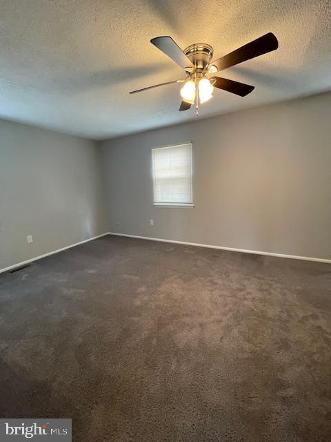 48 Fleming Street Newark, DE 19713 - Photo 9 of 16 an empty room with a window and a ceiling fan