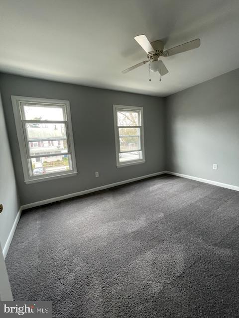 48 Fleming Street Newark, DE 19713 - Photo 10 of 16 an empty room with windows and fan