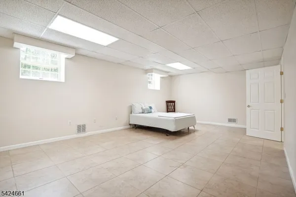 a view of bedroom with furniture and window
