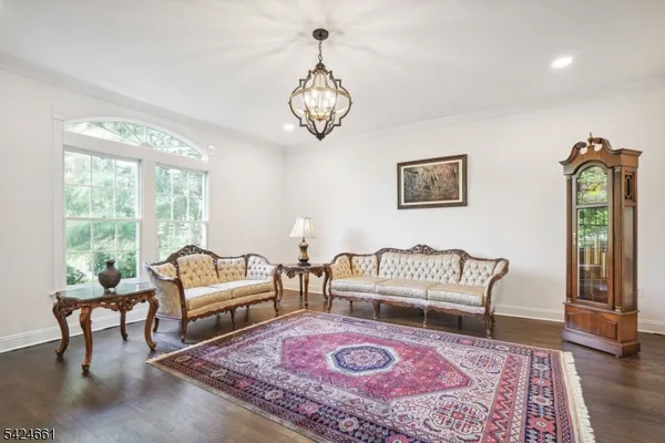 a living room with furniture a rug and a window