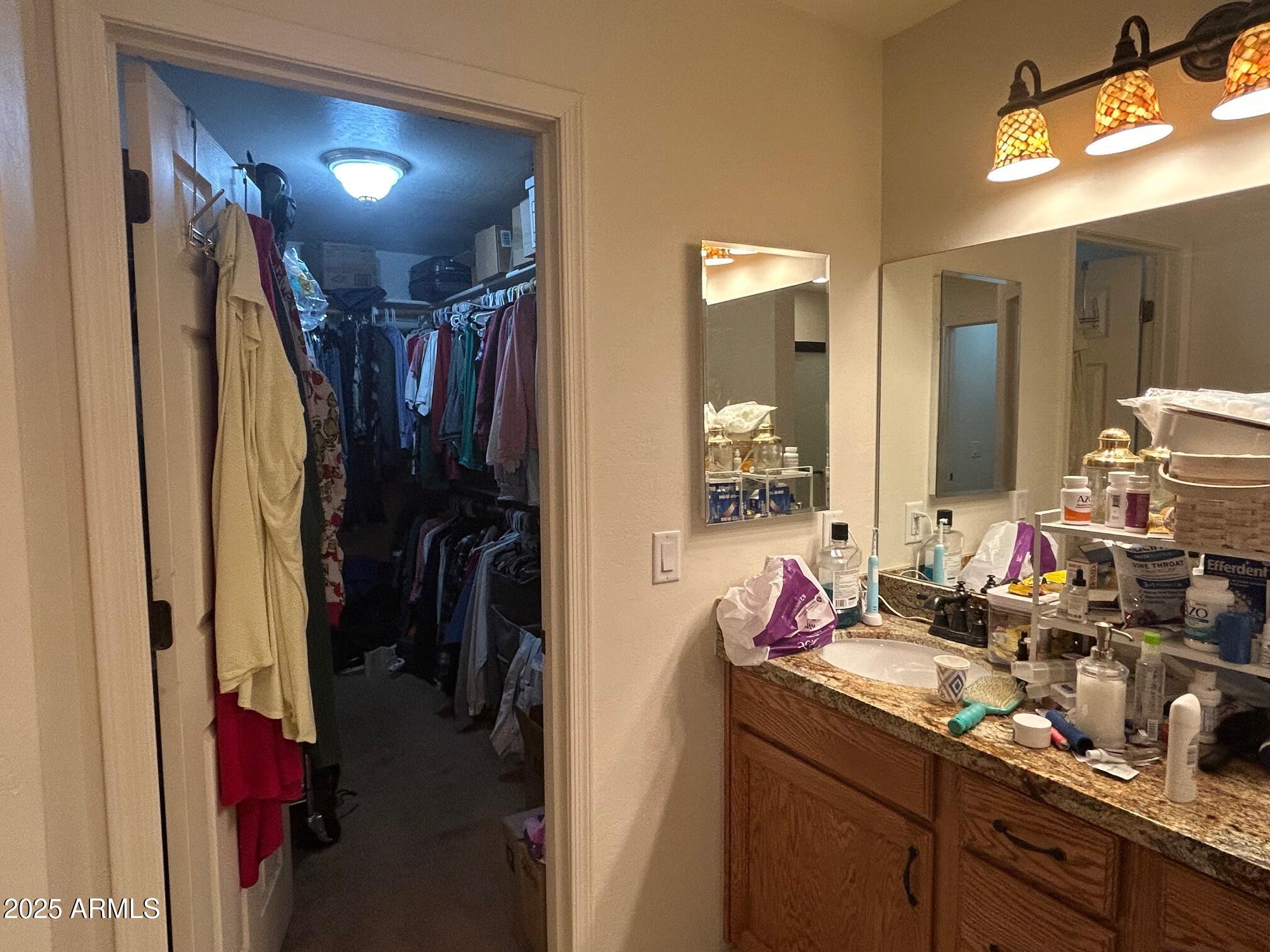 5107 Forest View Road Lakeside, AZ 85929 - Photo 12 of 24 a bathroom with a double vanity sink and a mirror
