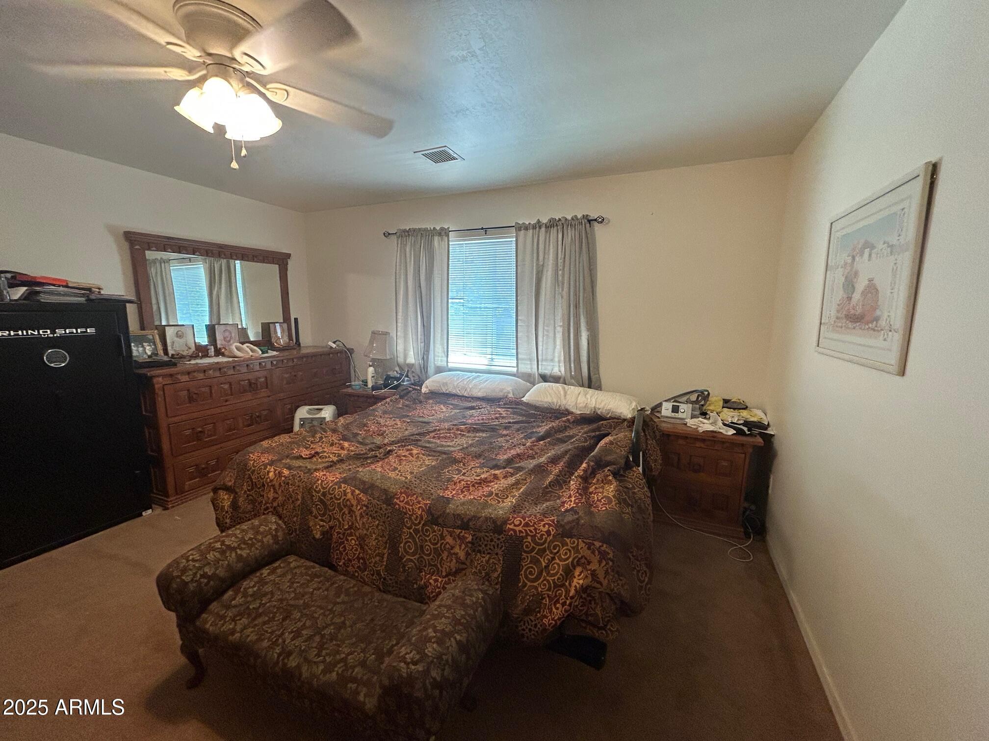 5107 Forest View Road Lakeside, AZ 85929 - Photo 14 of 24 a bedroom with a bed and window