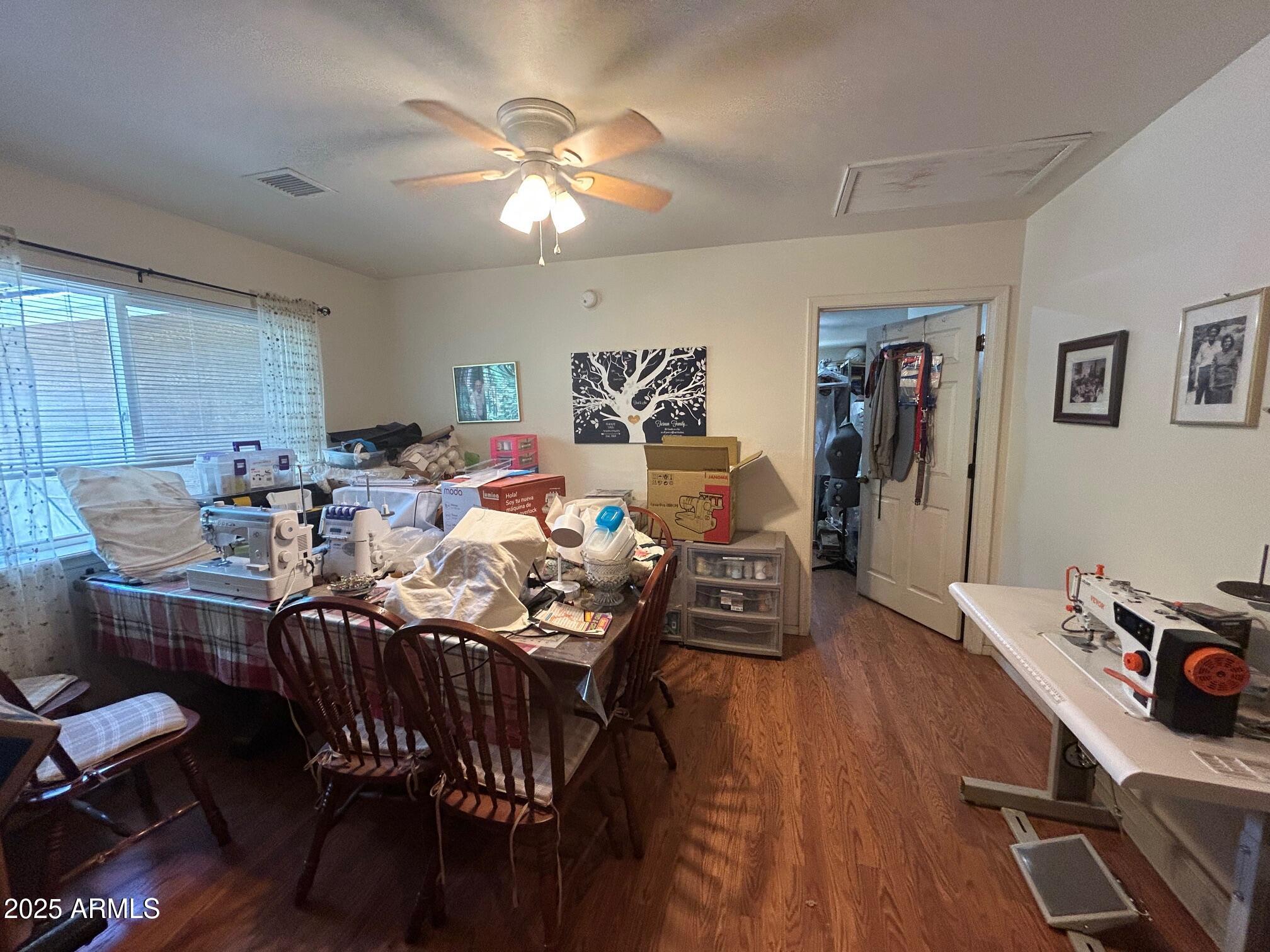 5107 Forest View Road Lakeside, AZ 85929 - Photo 16 of 24 a view of a dining room with furniture and wooden floor