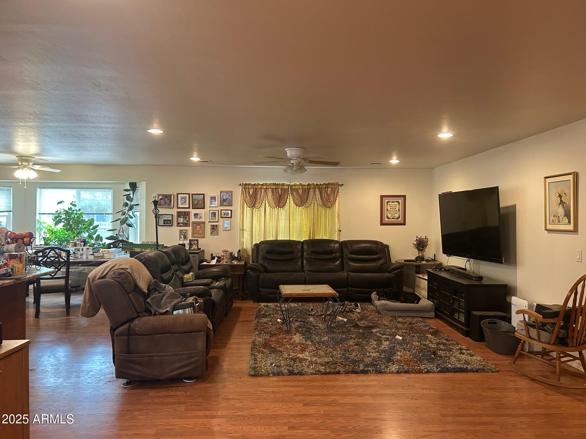 5107 Forest View Road Lakeside, AZ 85929 - Photo 2 of 24 a living room with furniture and a flat screen tv