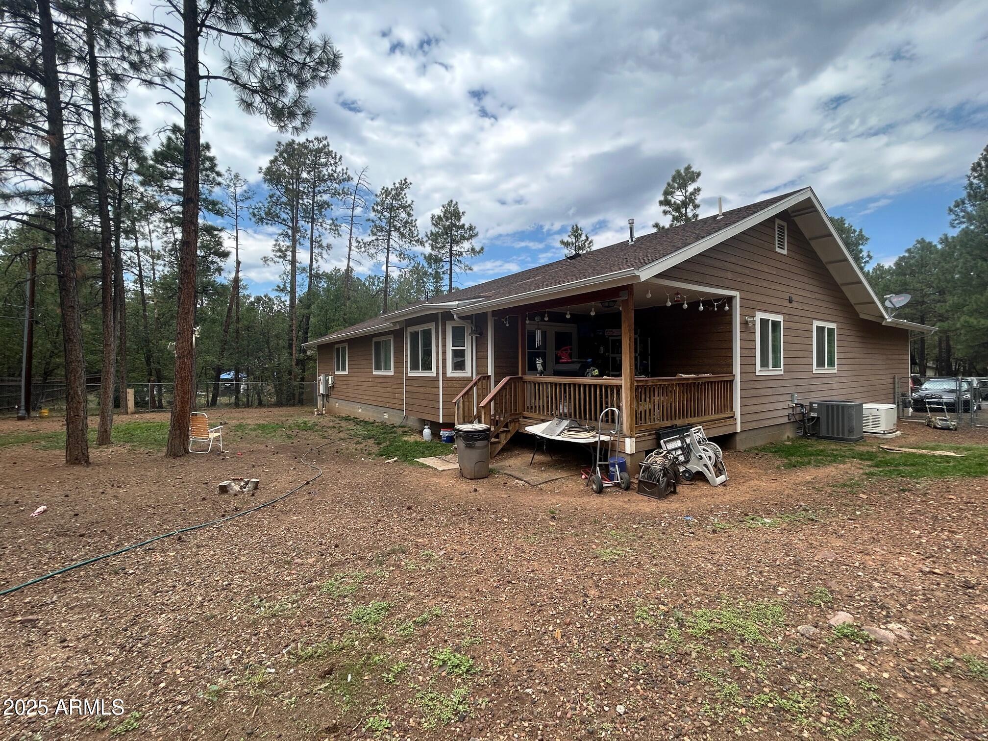 5107 Forest View Road Lakeside, AZ 85929 - Photo 21 of 24 a view of a house with backyard and trees