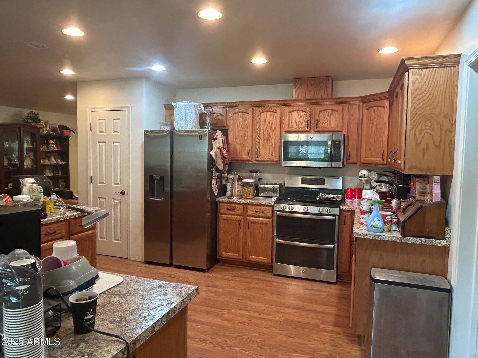 5107 Forest View Road Lakeside, AZ 85929 - Photo 3 of 24 a kitchen with stainless steel appliances granite countertop a refrigerator stove and sink