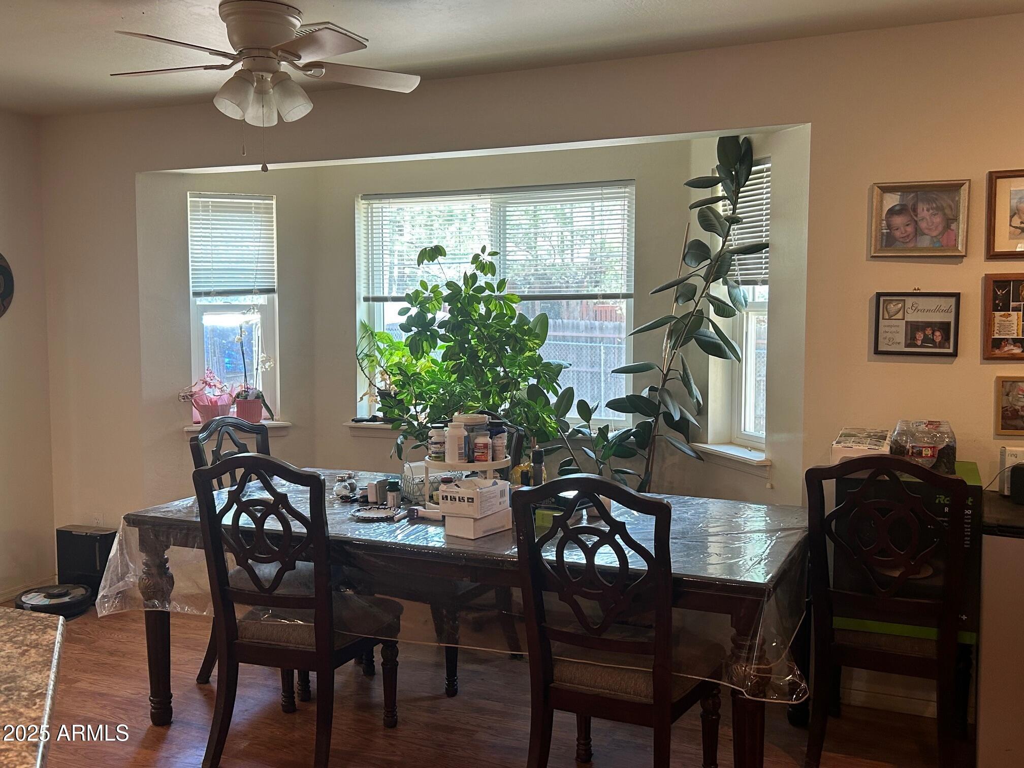 5107 Forest View Road Lakeside, AZ 85929 - Photo 5 of 24 a view of a dining room with furniture and chandelier
