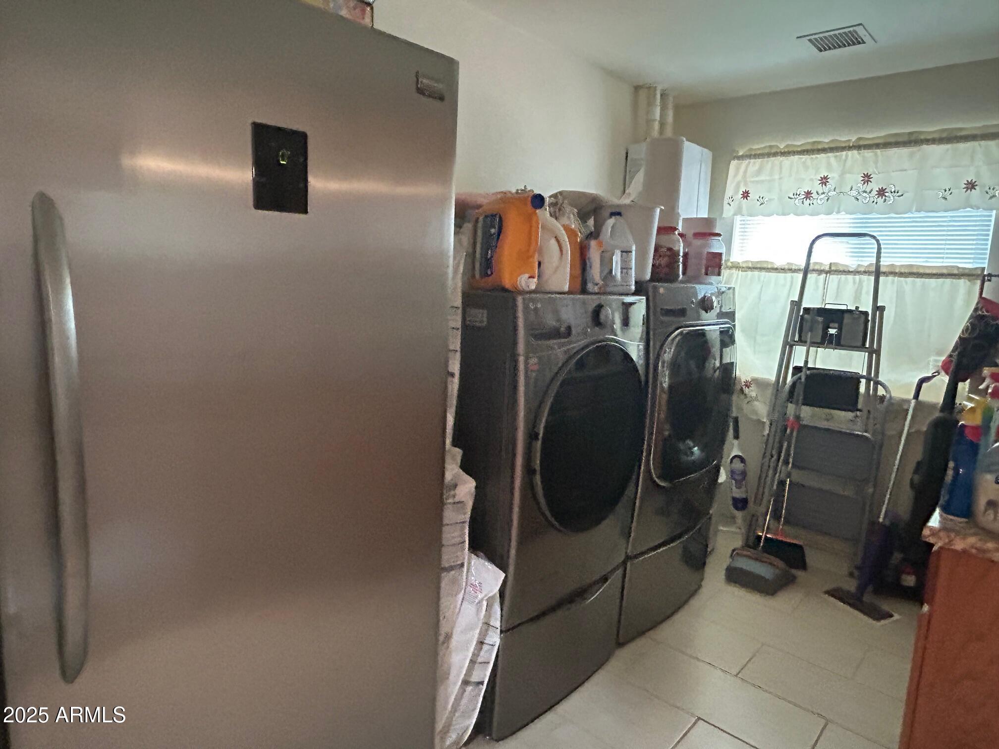 5107 Forest View Road Lakeside, AZ 85929 - Photo 6 of 24 a utility room with dryer and washer