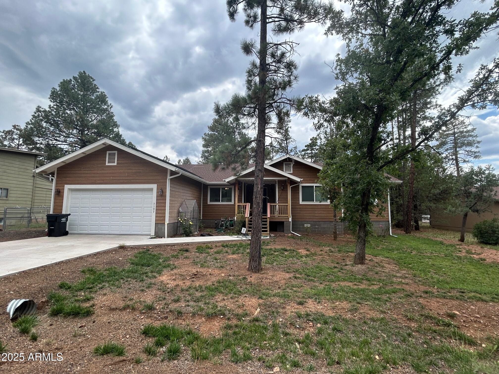 5107 Forest View Road Lakeside, AZ 85929 - Photo 7 of 24 a backyard of a house with yard and tree