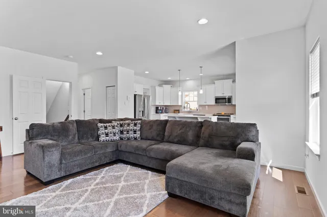 a living room with furniture and a couch