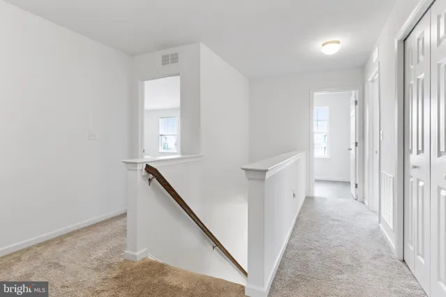 a view of a hallway with windows