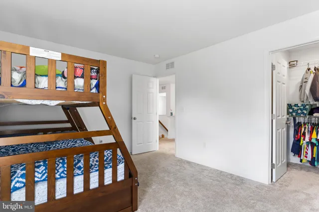 a view of an empty room with stairs