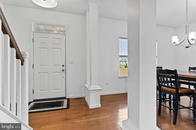 a view of a hallway with seating area