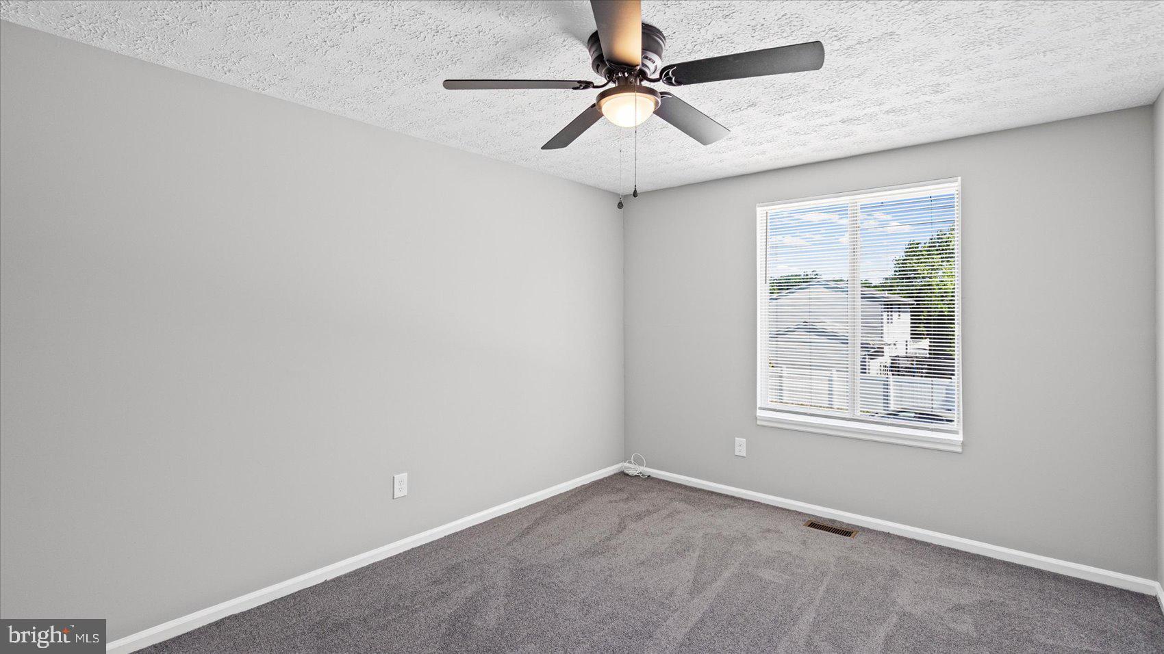 3709 Redberry Way Nottingham, MD 21236 - Photo 22 of 45 an empty room with windows and fan