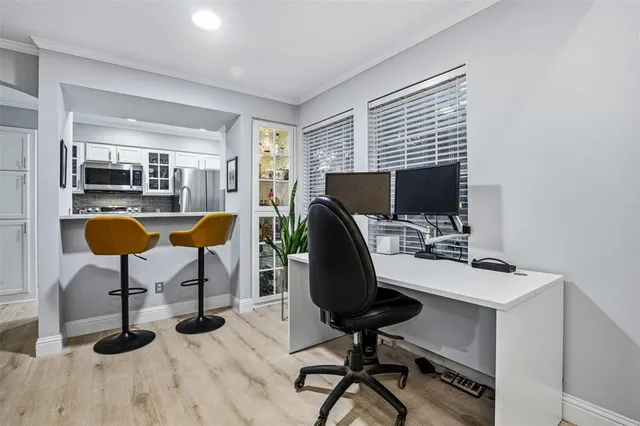 a view of a workspace with furniture