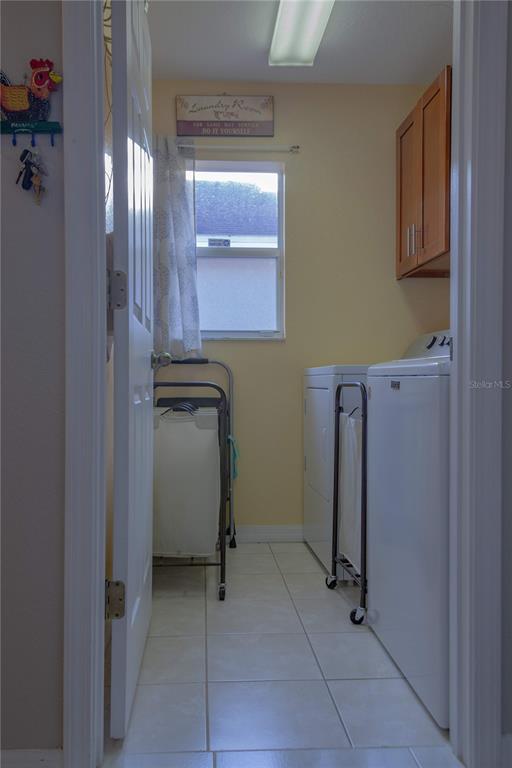 11241 Cocoa Beach Drive Riverview, FL 33569 - Photo 17 of 36 a utility room with closet dryer and washer