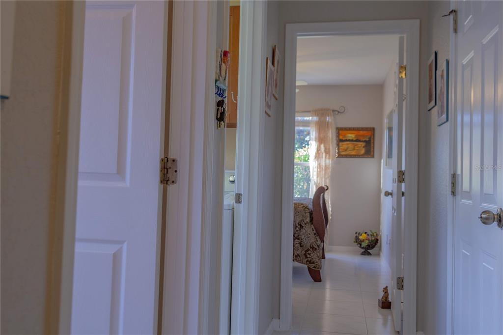 11241 Cocoa Beach Drive Riverview, FL 33569 - Photo 18 of 36 a bathroom with a glass shower door
