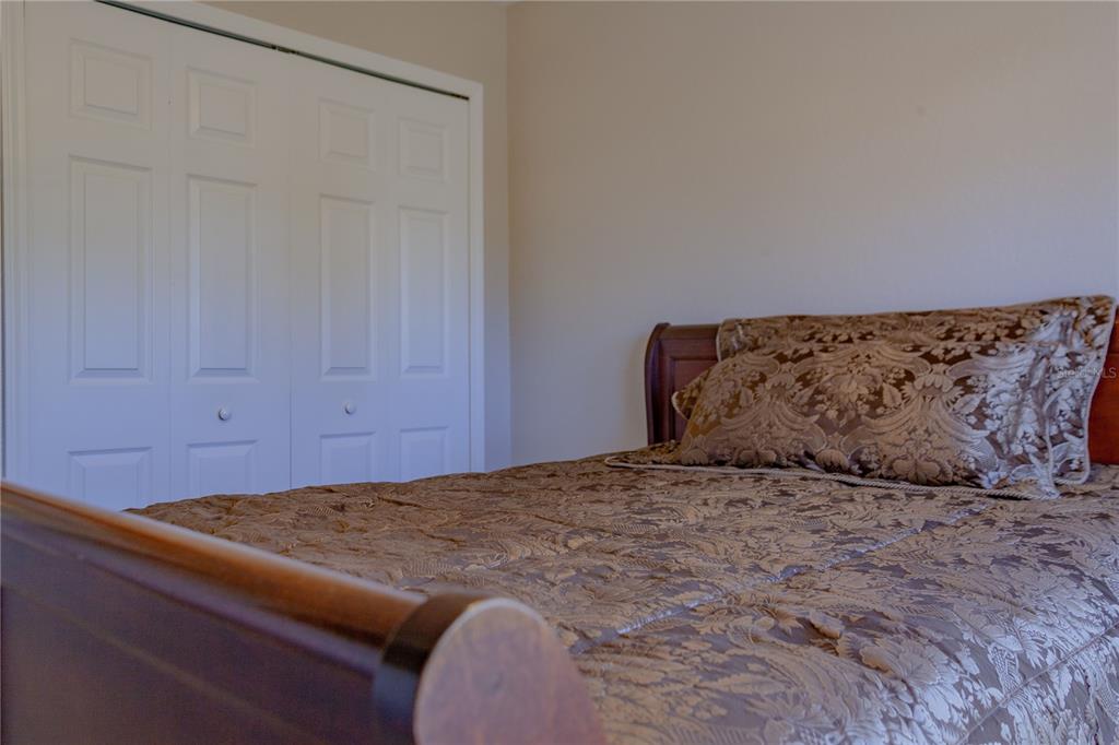 11241 Cocoa Beach Drive Riverview, FL 33569 - Photo 22 of 36 a bedroom with a bed and a window