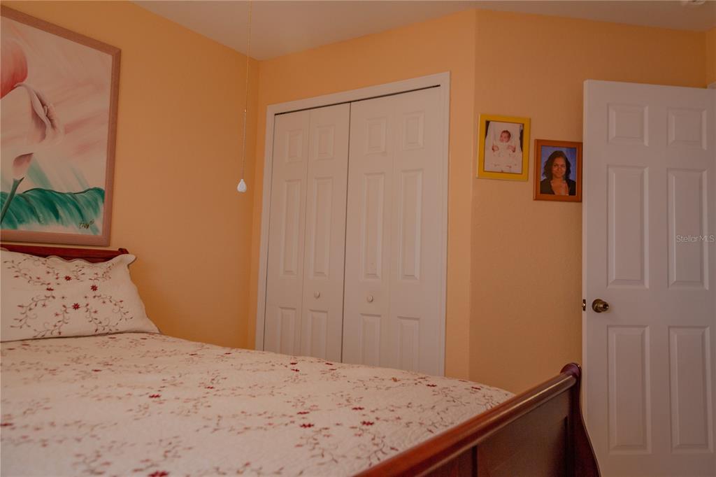 11241 Cocoa Beach Drive Riverview, FL 33569 - Photo 29 of 36 a bedroom with a bed and a window