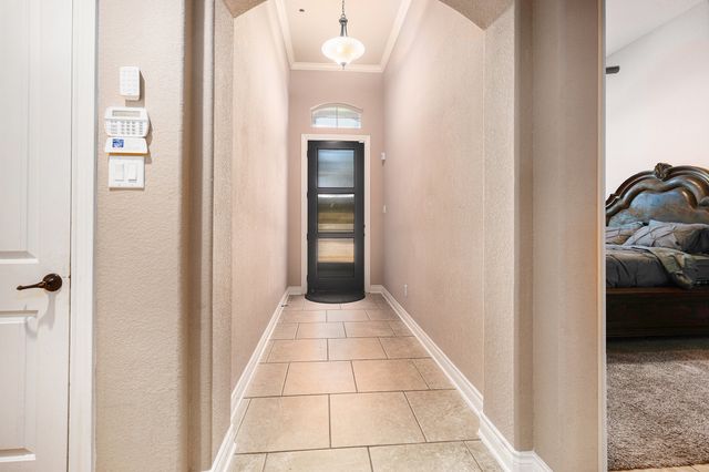 a view of a hallway and a livingroom with a hallway