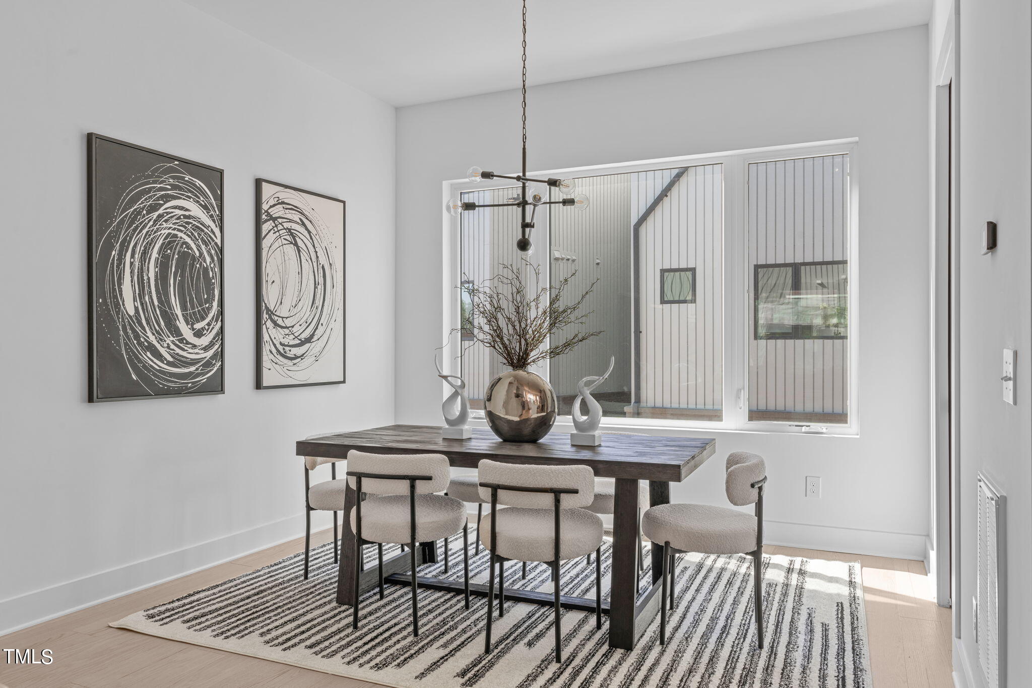 3003 Corbell Durham, NC 27701 - Photo 7 of 26 a view of a dining room with furniture window and wooden floor