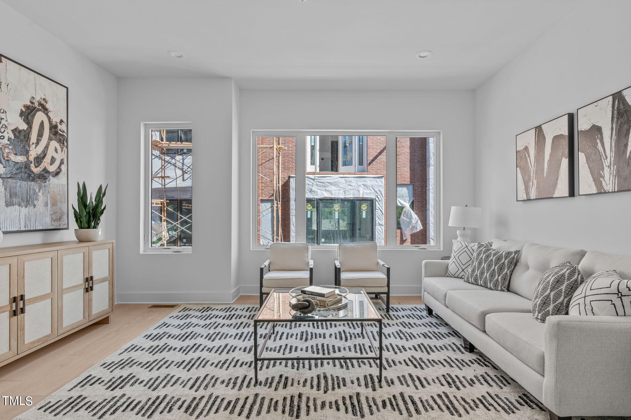 3003 Corbell Durham, NC 27701 - Photo 10 of 26 a living room with furniture a rug and a table