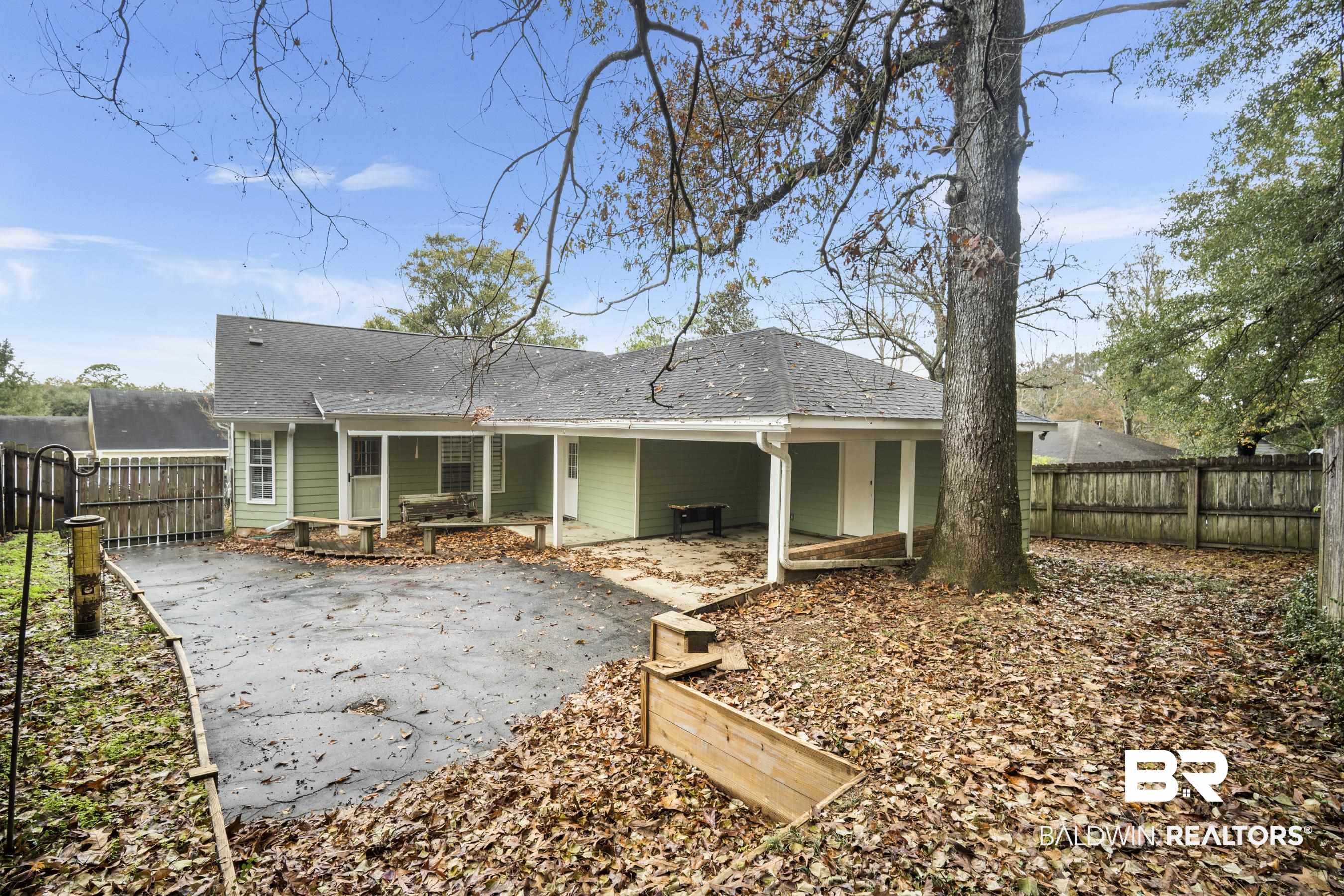 3101 Autumn Ridge Drive West Mobile, AL 36695 - Photo 29 of 36 Rear view of property with a patio, a fenced backyard, and roof with shingles