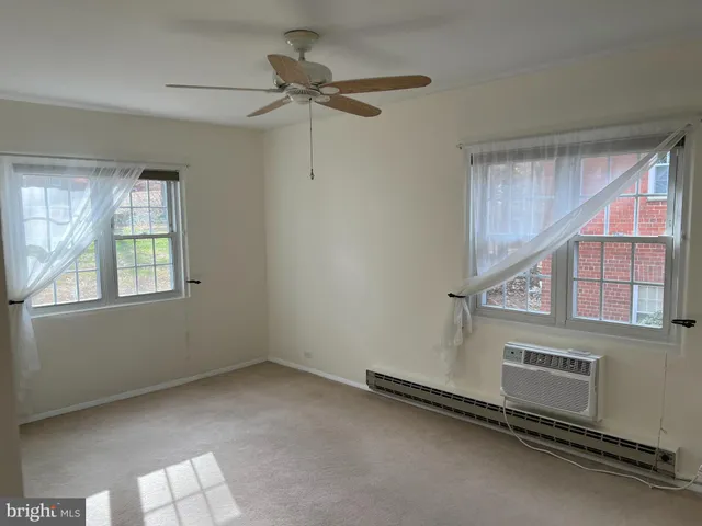 a view of a livingroom with a ceiling fan