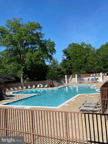 an outdoor sitting area with golf course