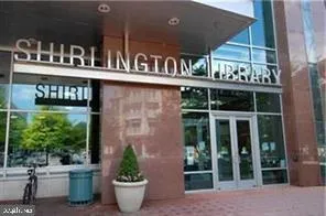 a group of people sitting in front of a building