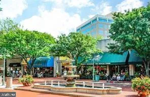 a view of people sitting on a street