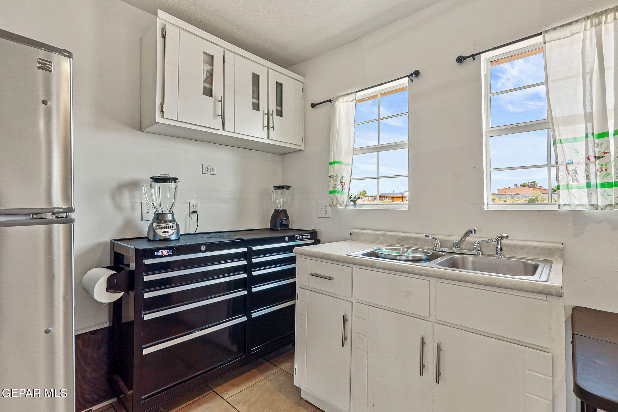 13419 Mendoza Road San Elizario, TX 79849 - Photo 15 of 55 a kitchen with a sink and cabinets
