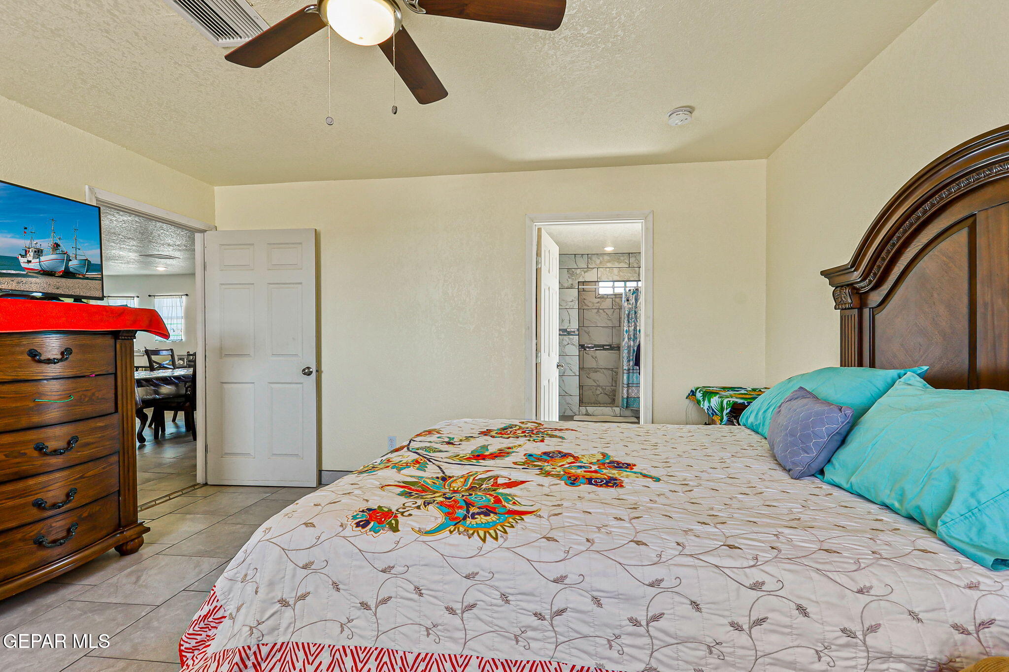 13419 Mendoza Road San Elizario, TX 79849 - Photo 19 of 55 a bedroom with a bed and a cabinets