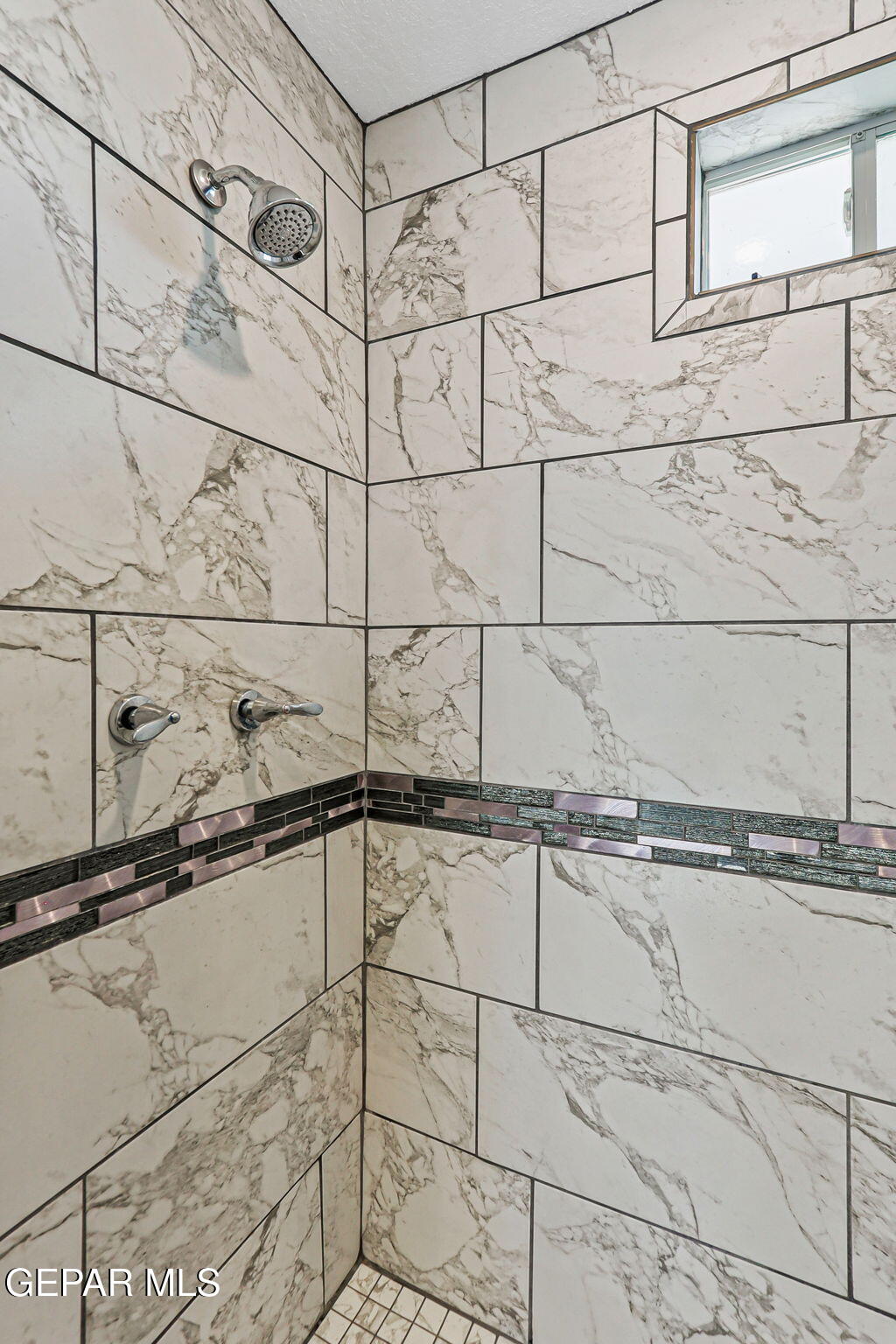 13419 Mendoza Road San Elizario, TX 79849 - Photo 22 of 55 a bathroom with bathtub and shower