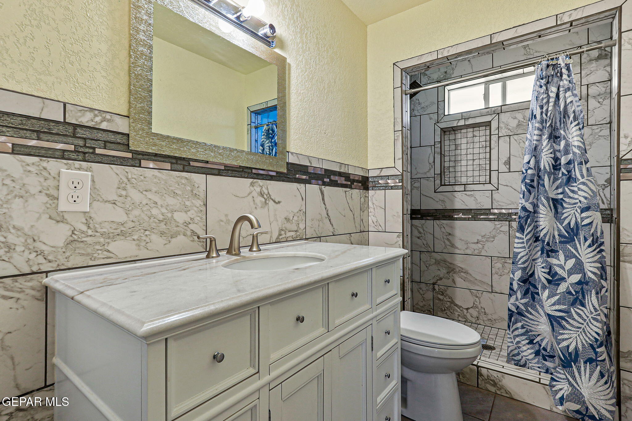 13419 Mendoza Road San Elizario, TX 79849 - Photo 27 of 55 a bathroom with a sink toilet and shower