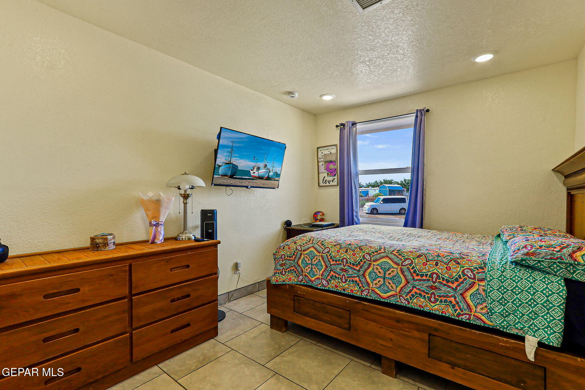 13419 Mendoza Road San Elizario, TX 79849 - Photo 29 of 55 a bedroom with a bed and furniture