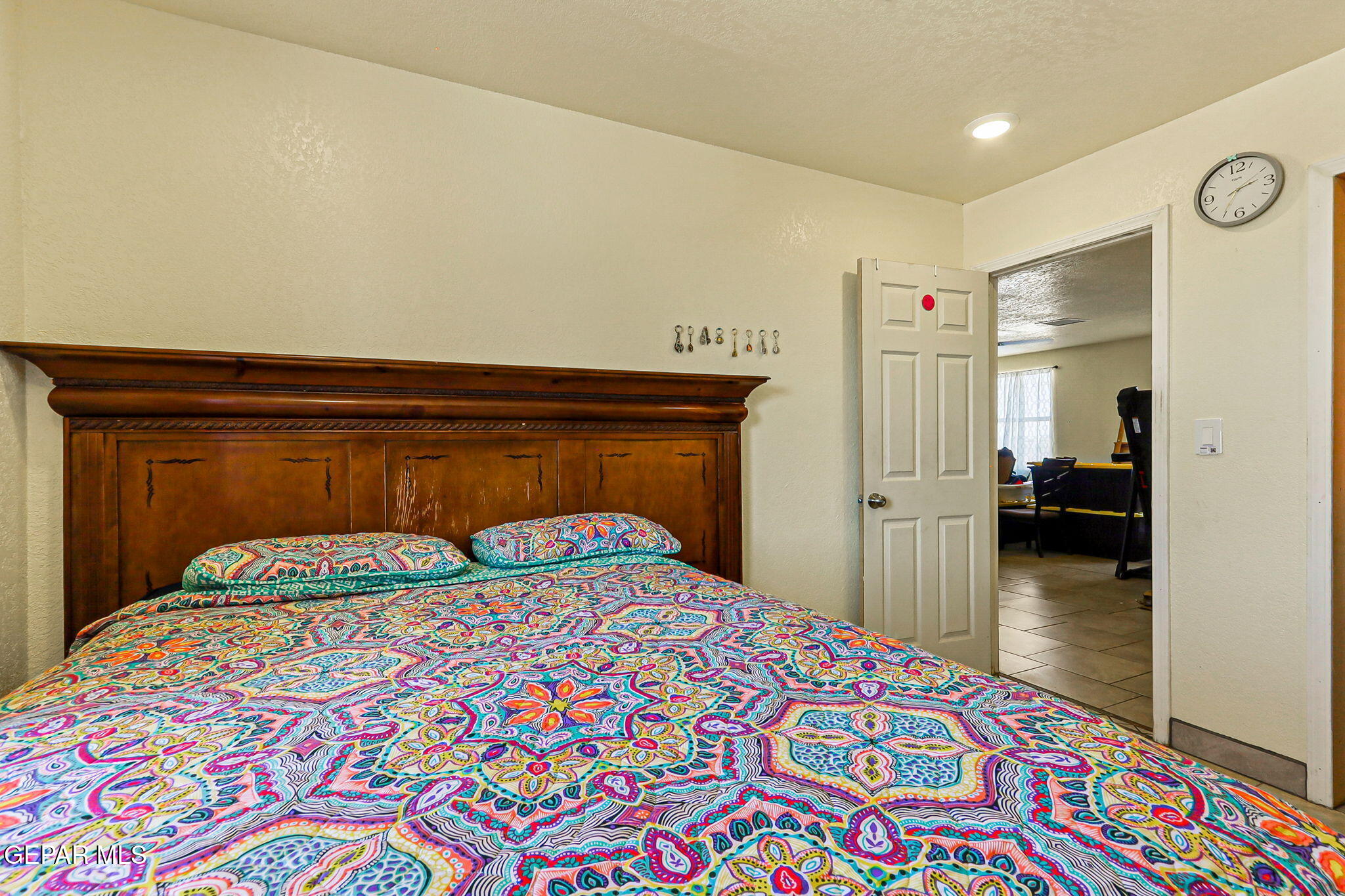 13419 Mendoza Road San Elizario, TX 79849 - Photo 30 of 55 a bedroom with a bed and a table in it