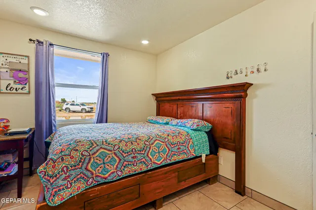 a view of washer and dryer with bathroom in the background