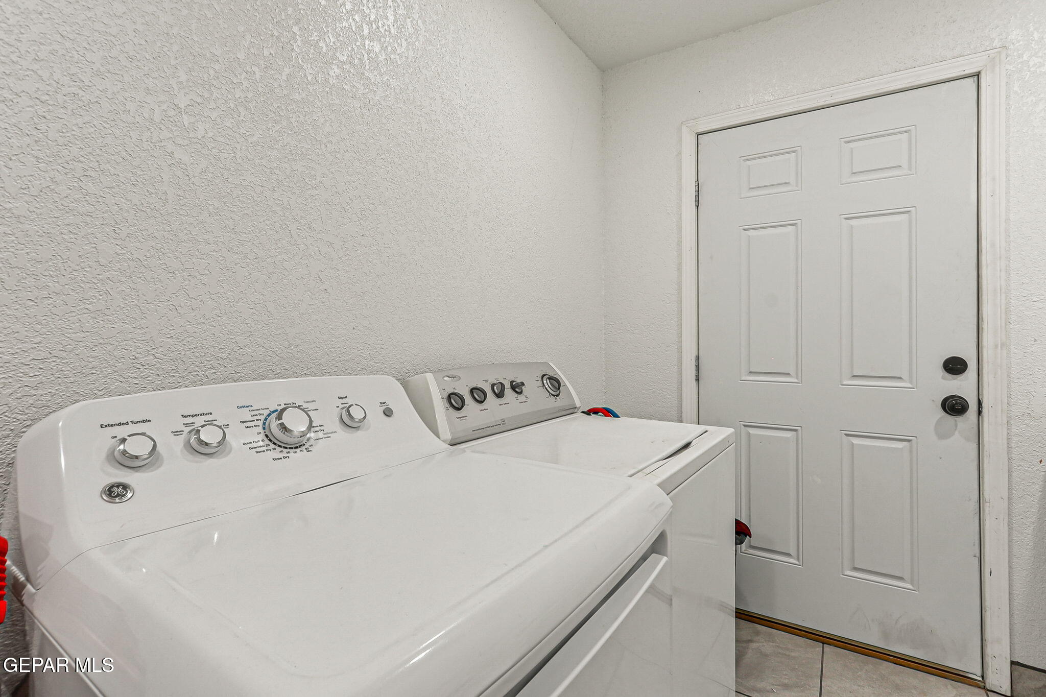 13419 Mendoza Road San Elizario, TX 79849 - Photo 33 of 55 a utility room with dryer and washer