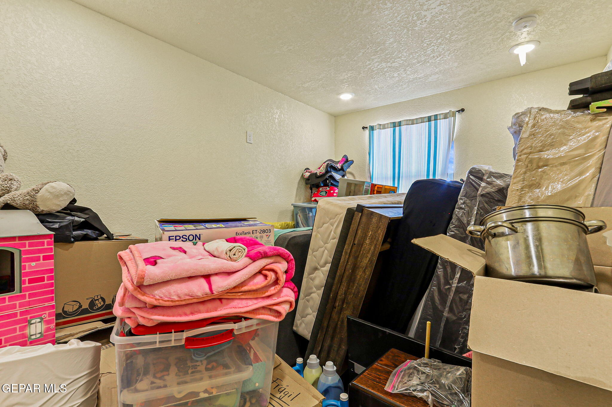 13419 Mendoza Road San Elizario, TX 79849 - Photo 35 of 55 a bedroom with furniture and a bed