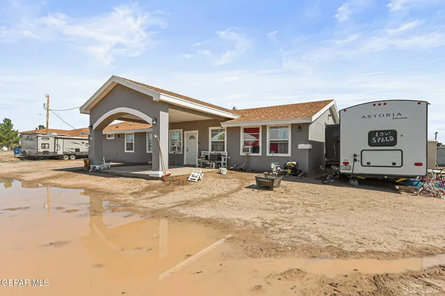 a front view of a house with a swimming pool