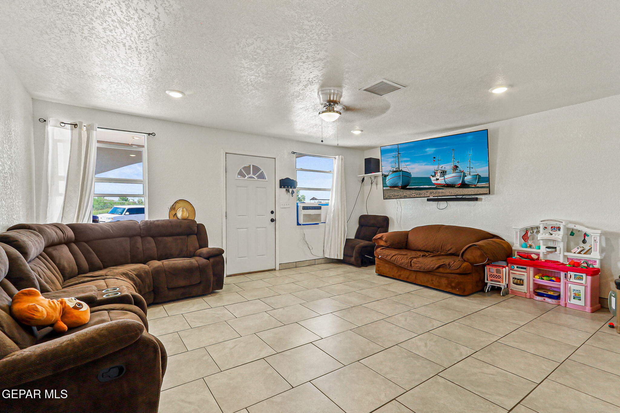 13419 Mendoza Road San Elizario, TX 79849 - Photo 4 of 55 a bedroom with furniture and a chandelier
