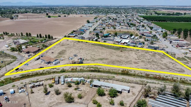 an aerial view of swimming pool with outdoor seating