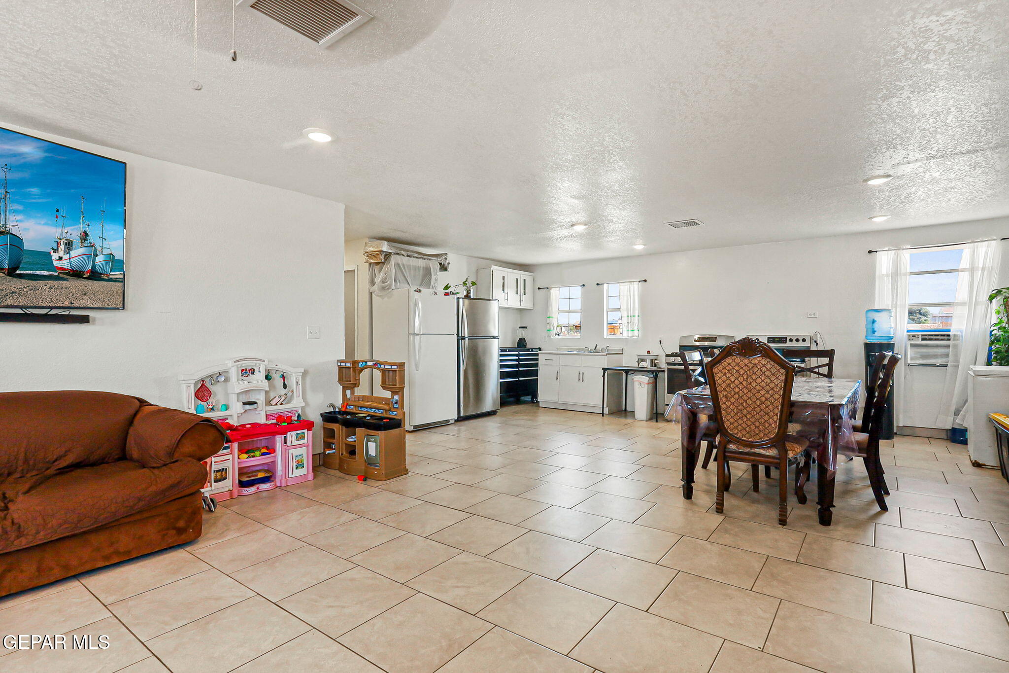 13419 Mendoza Road San Elizario, TX 79849 - Photo 7 of 55 a living room with furniture and a view of kitchen